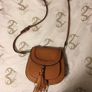 Cross body brown faux leather saddle bag