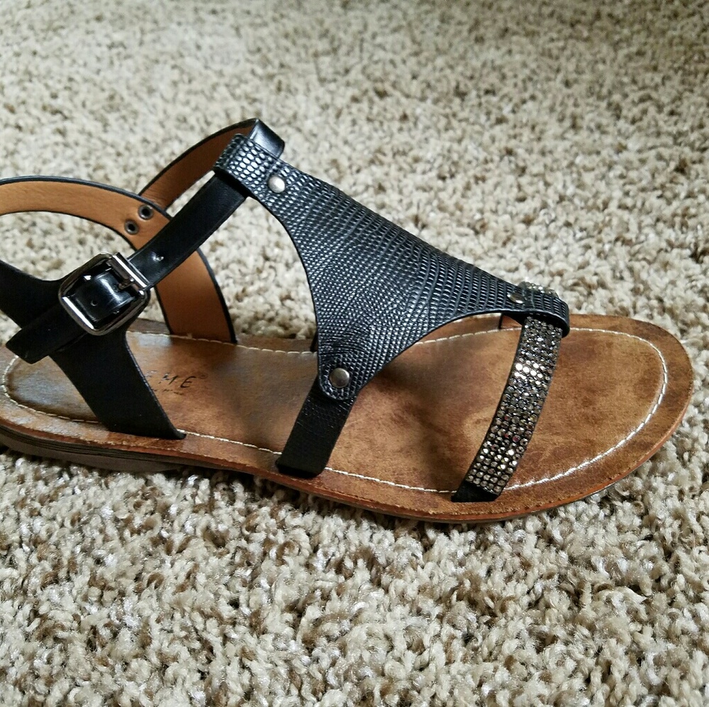Black gladiator sandal, never worn