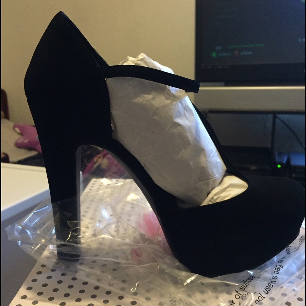 Black suede pumps