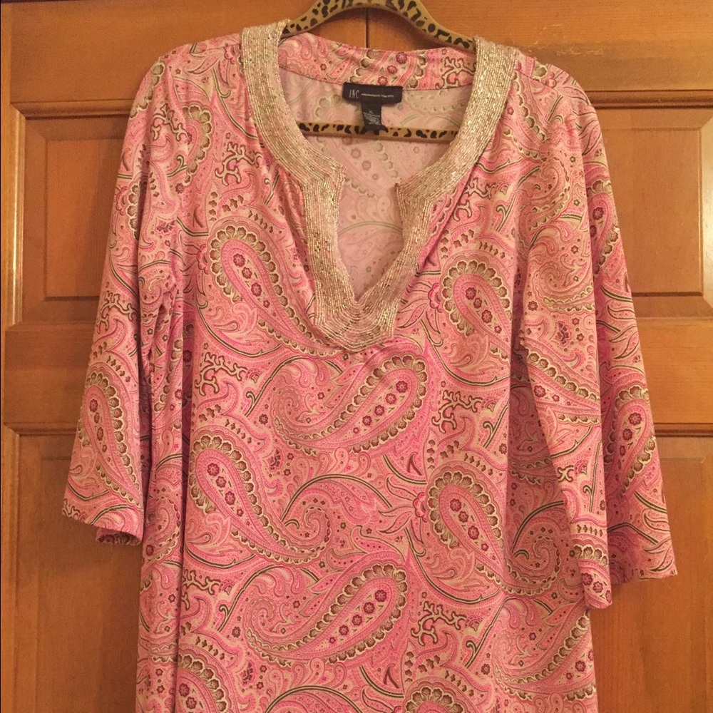 Gorgeous top with hand beading along collar.