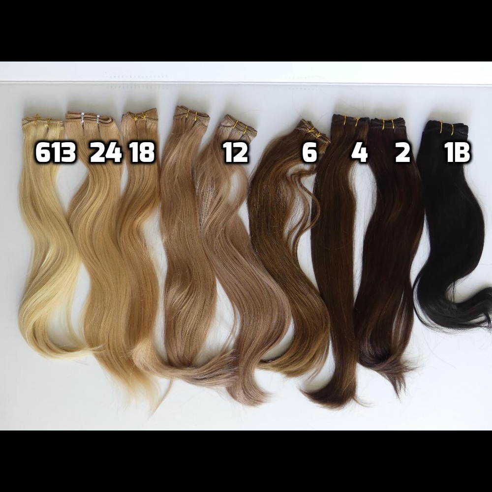 Wefted bundles of human hair extensions 100grams.