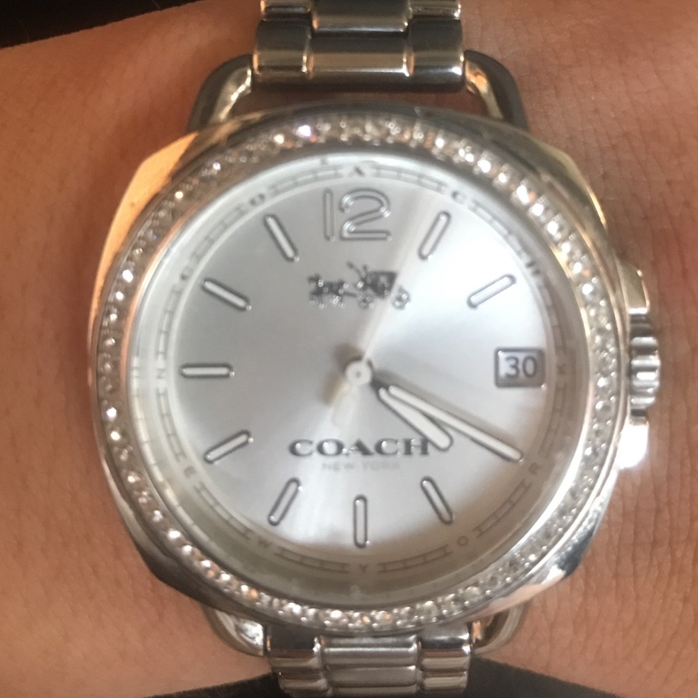 Silver and diamond coach watch
