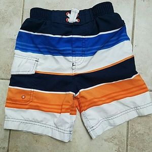 Orange and blue children's Place swim trunks