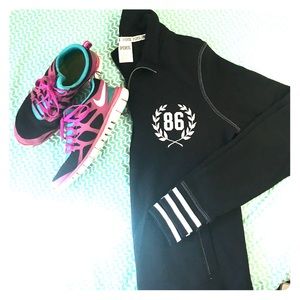 Pink quarter zip and Nike shoes