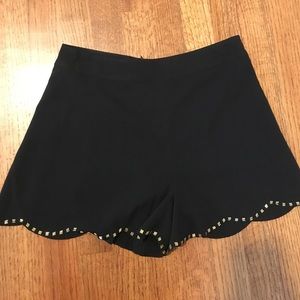 Black, scalloped shorts with gold beading