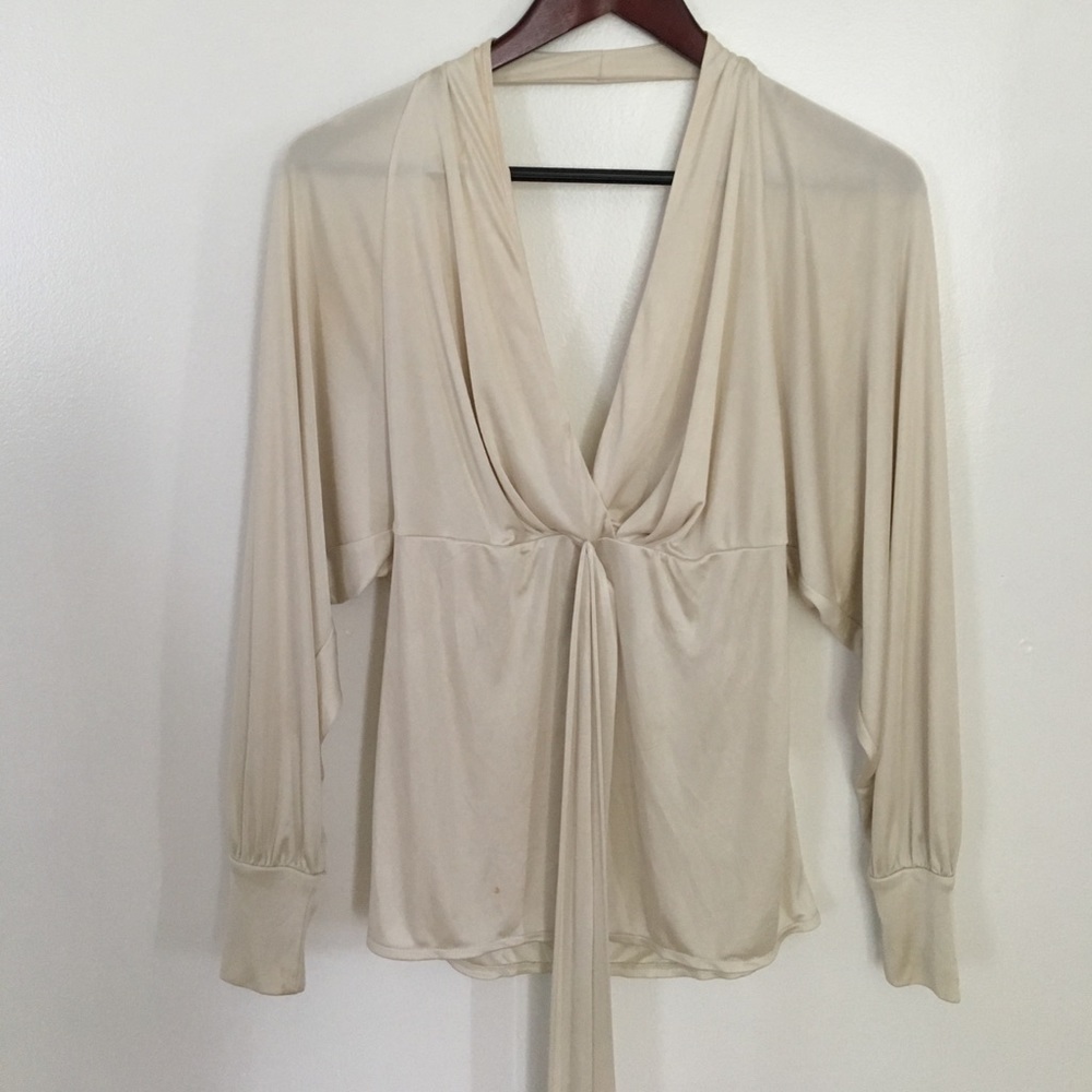 Loose white long sleeved top with tie detail