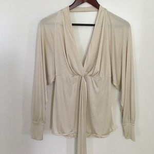 Loose white long sleeved top with tie detail