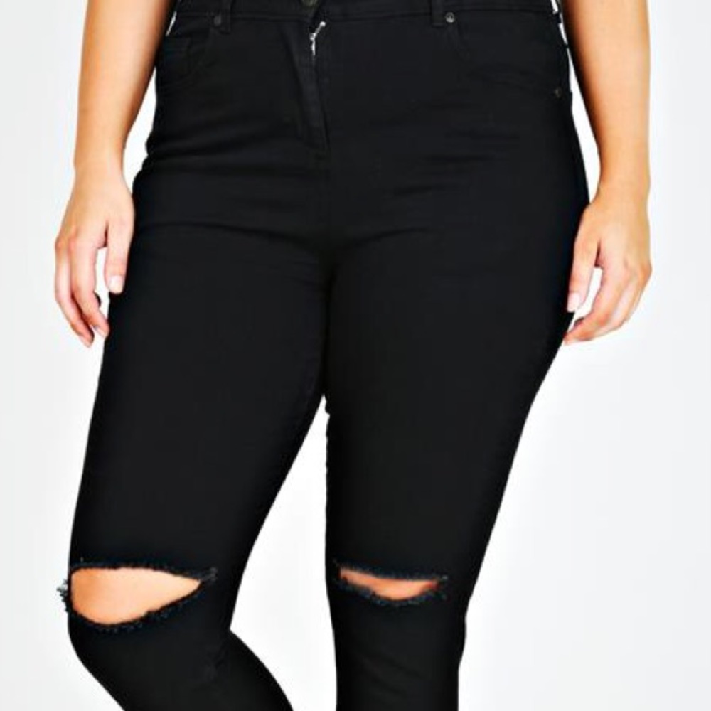 Ladies black ripped knee jeans