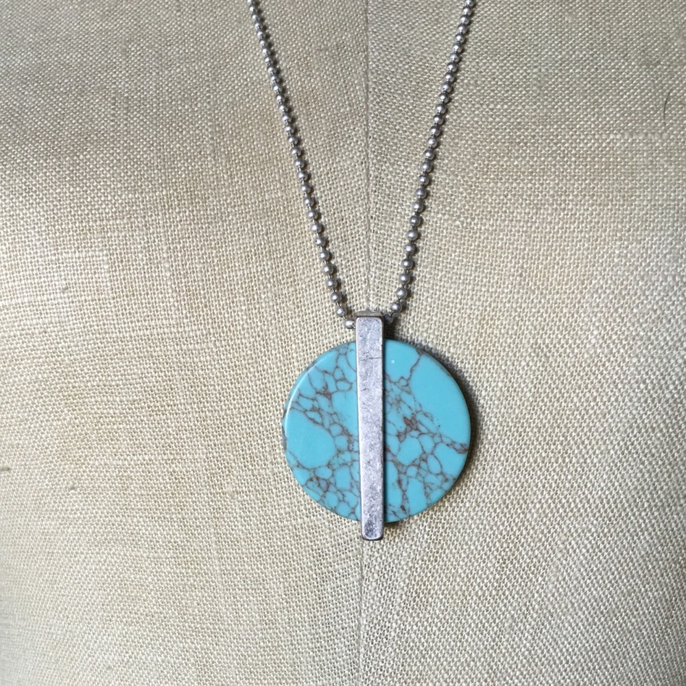 Turquoise necklace with silver accents.