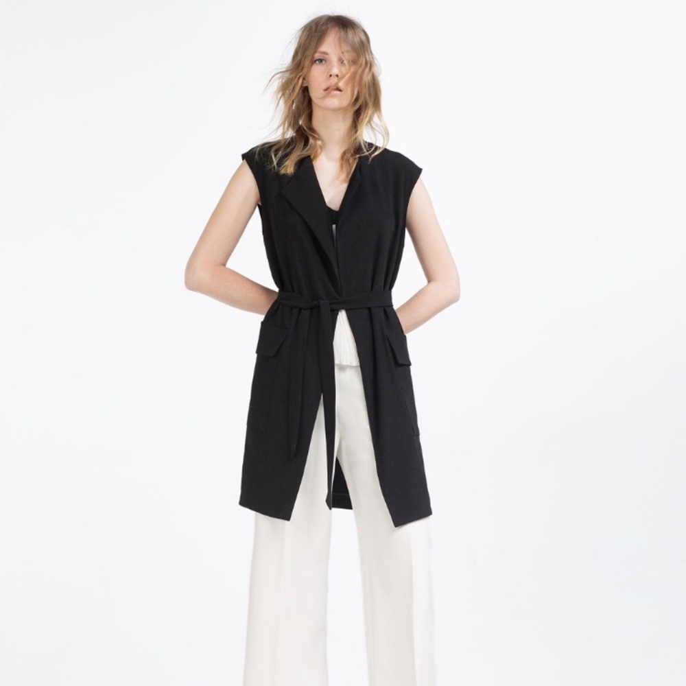 Black long sleeveless waistcoat