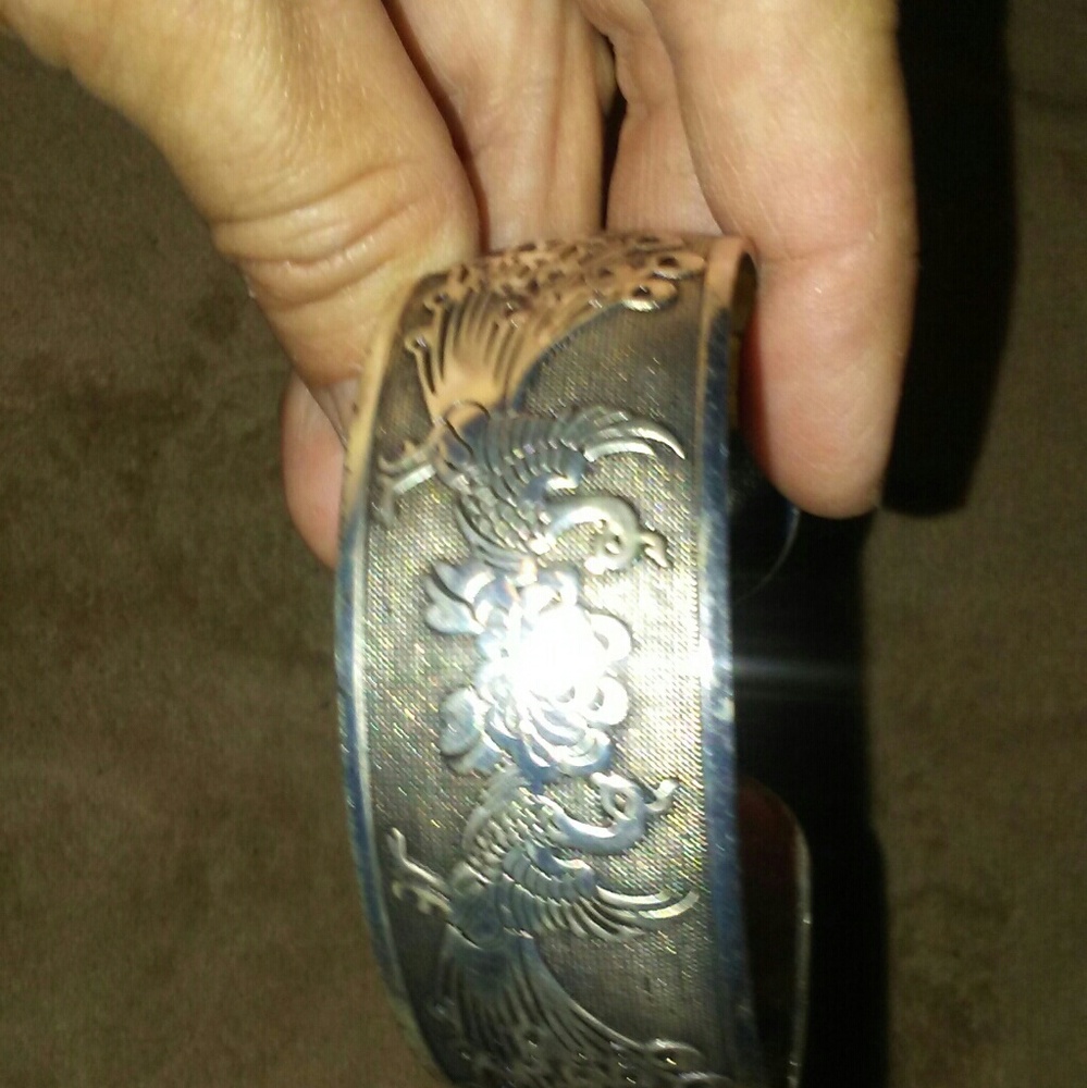 Tuscan silver Peacock design.