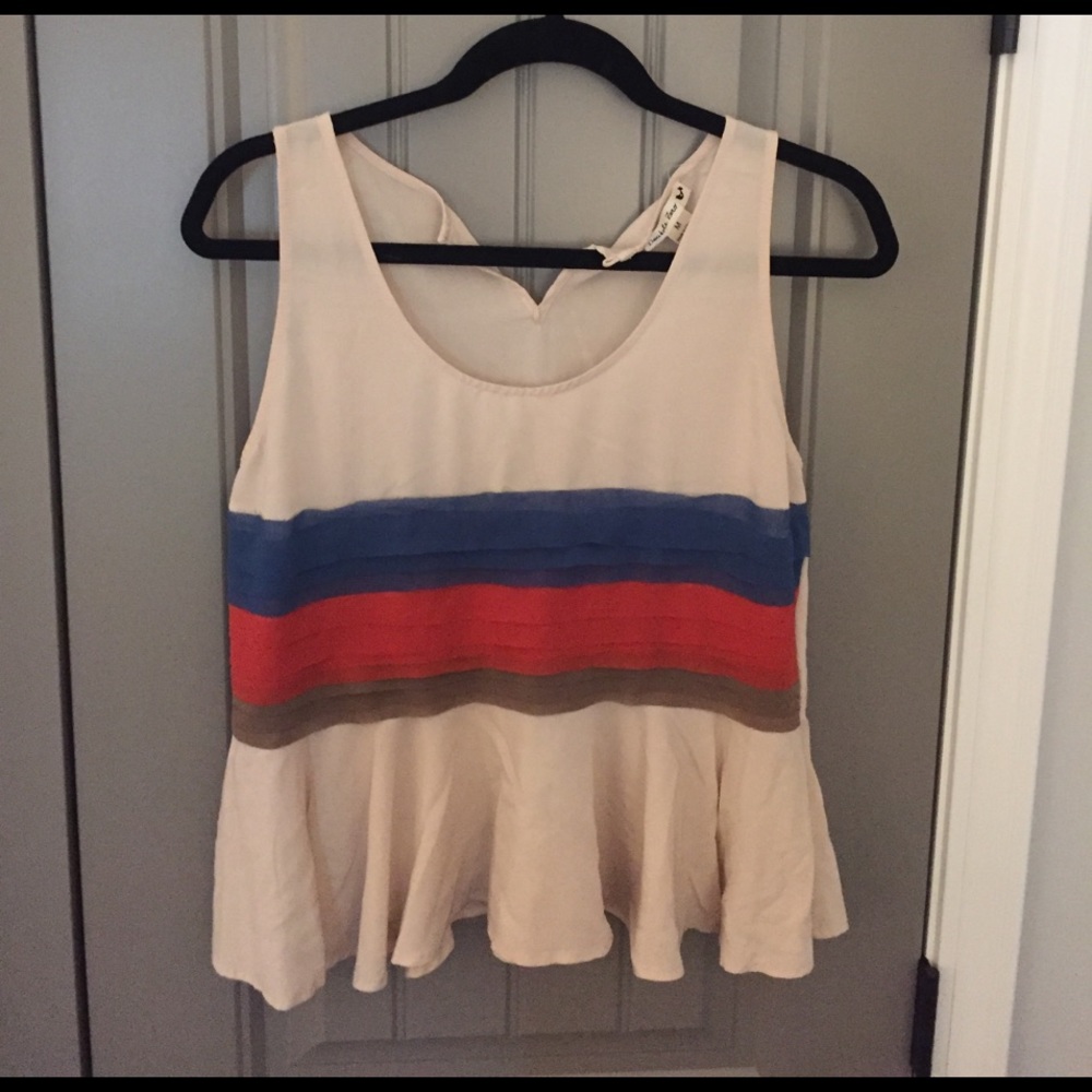 Beige peplum tank.
