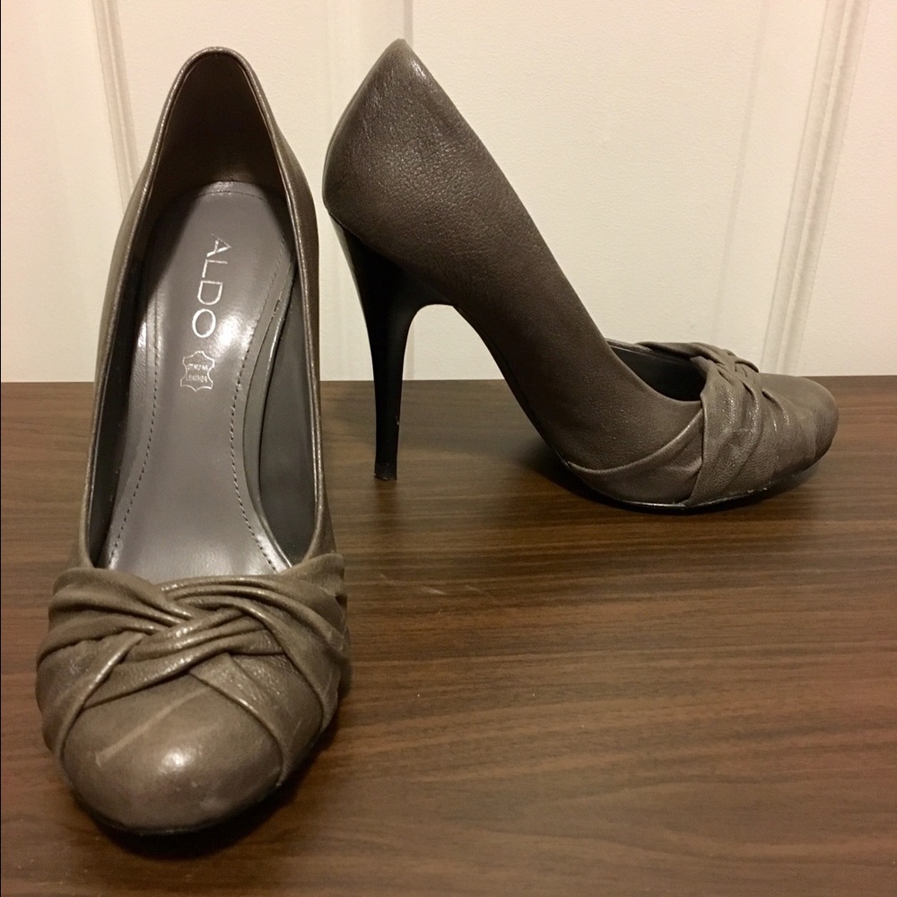 Dark grey round toe pumps.