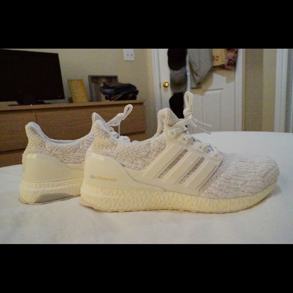 All white adidas ultra boosts