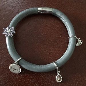 Endless bracelet with 4 charms included.