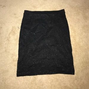 Black pencil skirt with lace flowers  in design