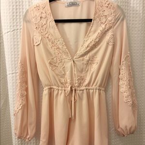 Baby pink romper with lace detail