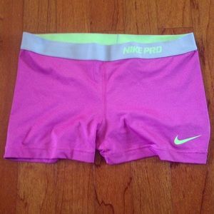 Pink and green Nike pro spandex compression shorts