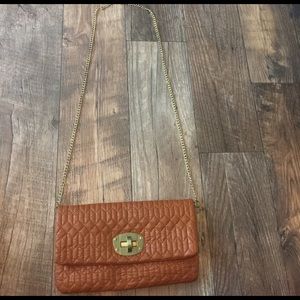 Tan cross body can also be used as a clutch