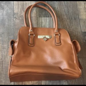 Tan purse with cute details!