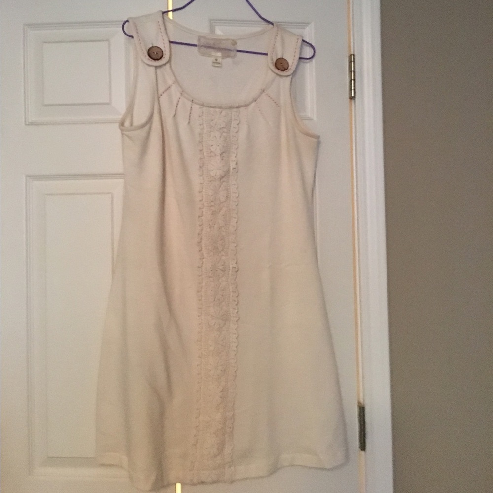 Cream dress with embroidery and large brown button