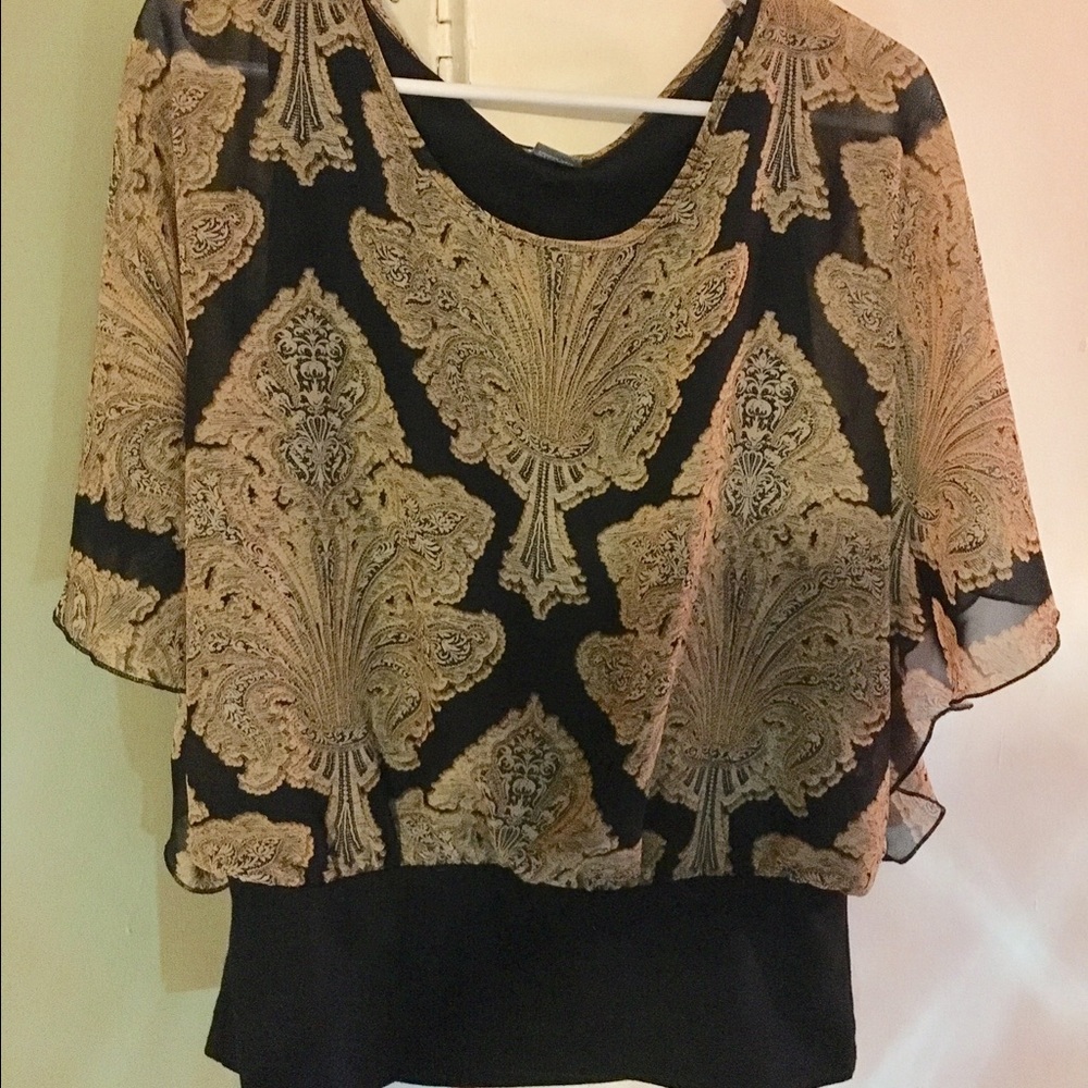 Beautiful dress up or dress down blouse.