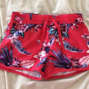 Red floral swim shorts