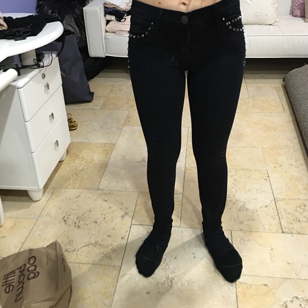 Black jeans with studs on the side
