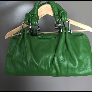 Green handbag.  B Collective