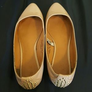 Nude flats with gold spikes