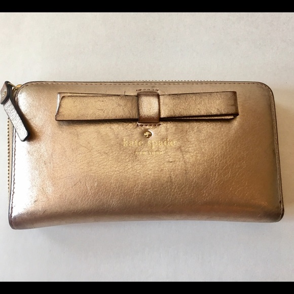 kate spade Handbags - Kate Spade Metallic Bow Wallet