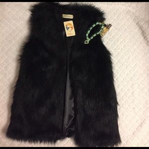 Luxurious Faux black fur vest fits like a large