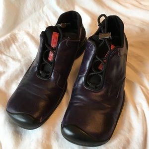 Prada purple leather shoes with toggle closure.