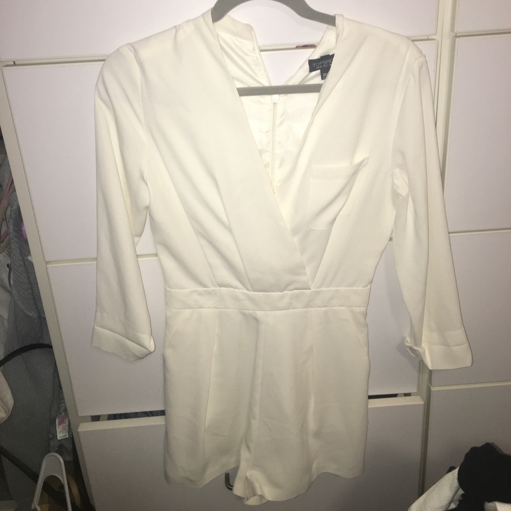 cream zip-back, crossed in front & pocketed romper