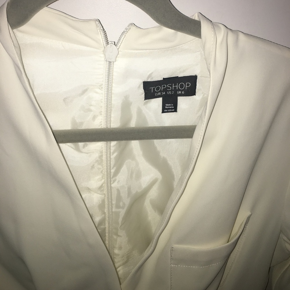 cream zip-back, crossed in front & pocketed romper - Picture 2 of 4