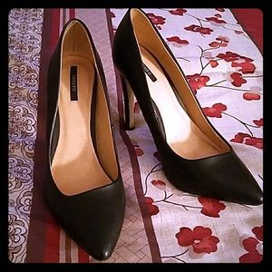 A pair of black heels