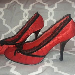 Red and black ruffled pumps