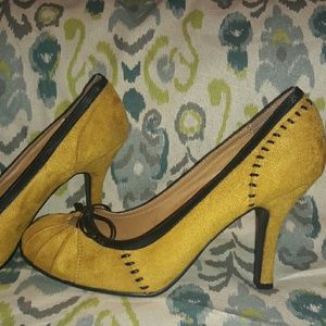 Yellow and black pumps