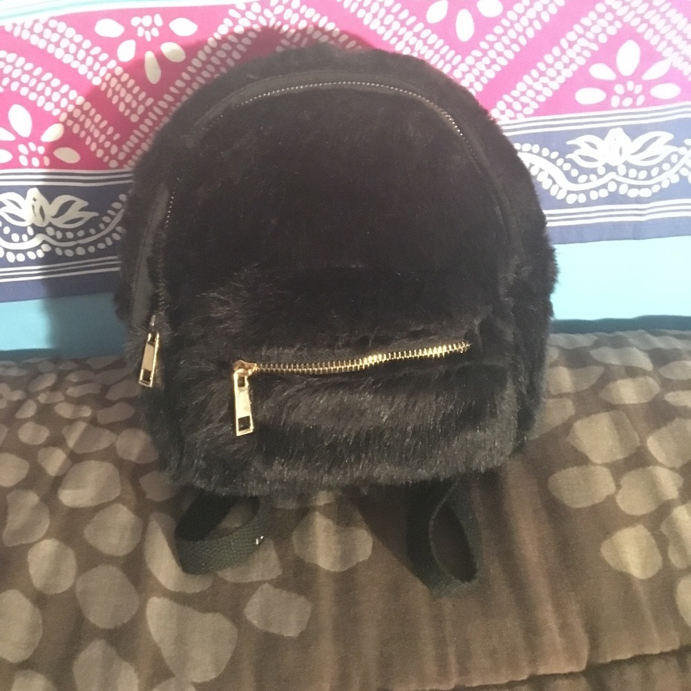 Small black fur backpack