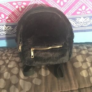 Small black fur backpack