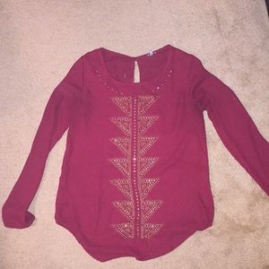 Long sleeve maroon top.