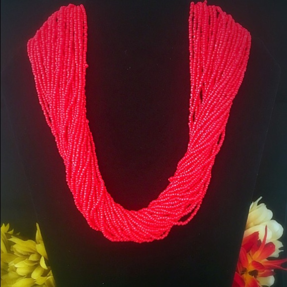 Coral color seed bead necklace and bracelet set.