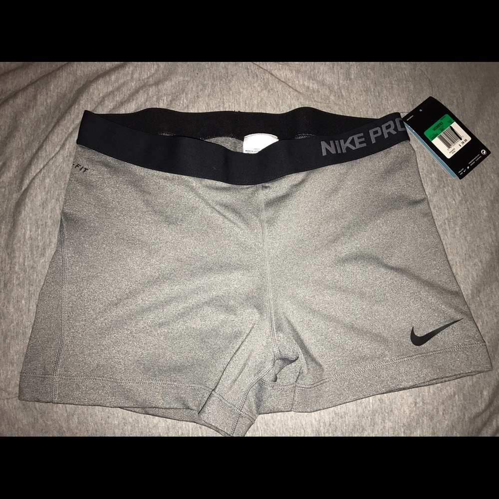 Nike pro spandex shorts, charcoal gray & black.
