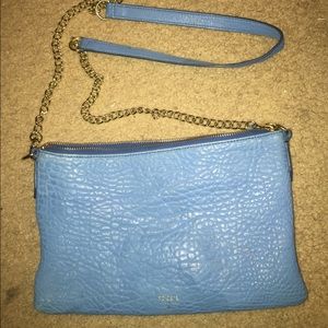 Gently used blue fossil purse.