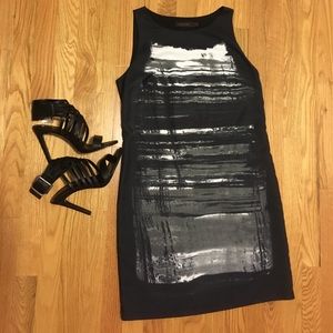 Black and white sleeveless sheath dress