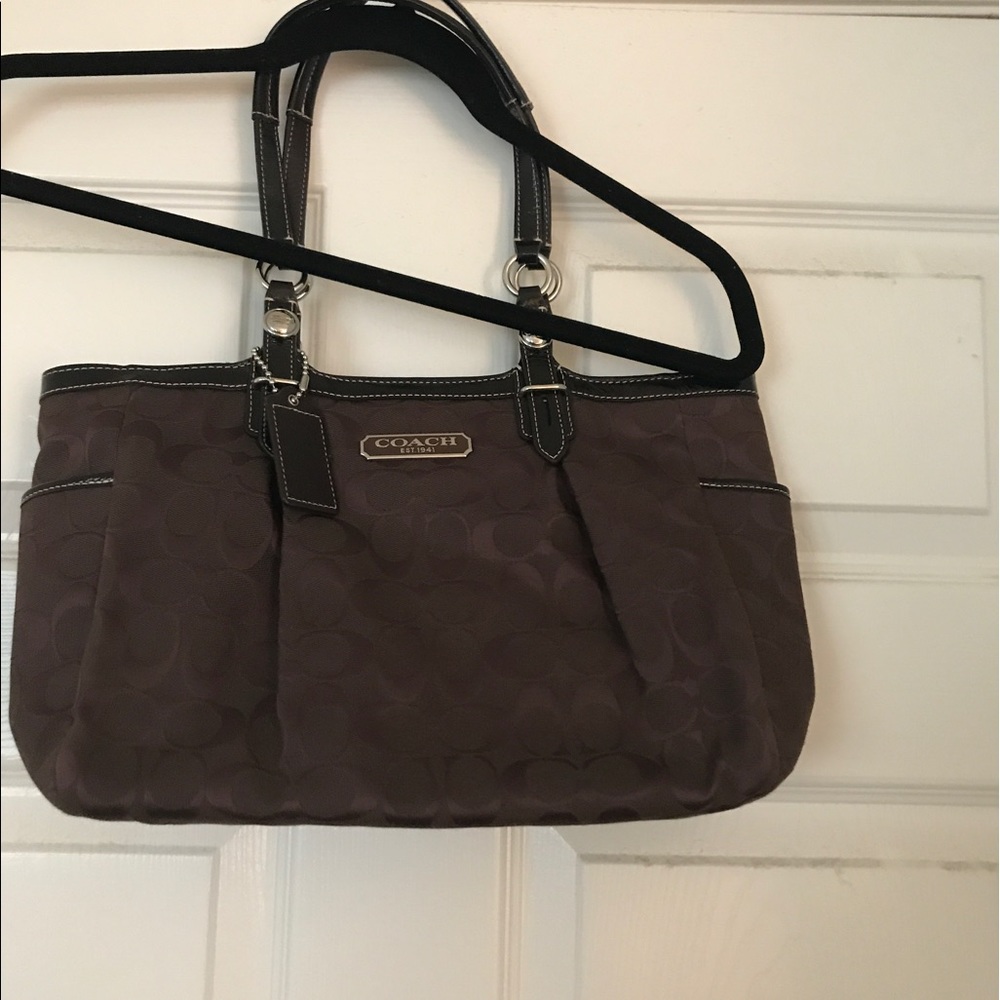 Used Coach shoulder bag.  Brown, signature pattern