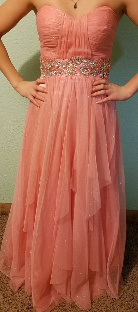 Coral gown with jewel belt line.