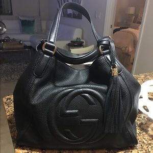 Gucci leather handbag with tassel.
