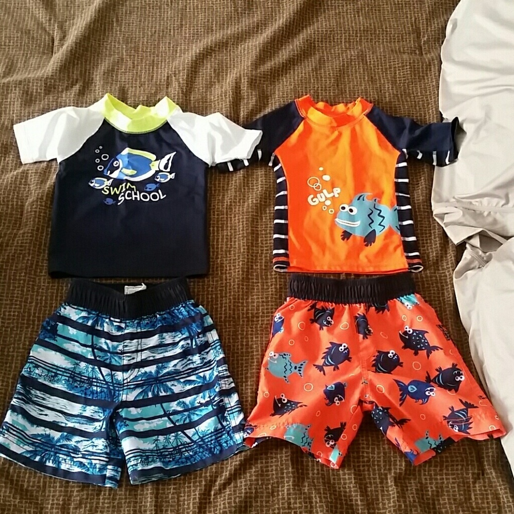 Set of 2 rash guards with matching swim trunks.