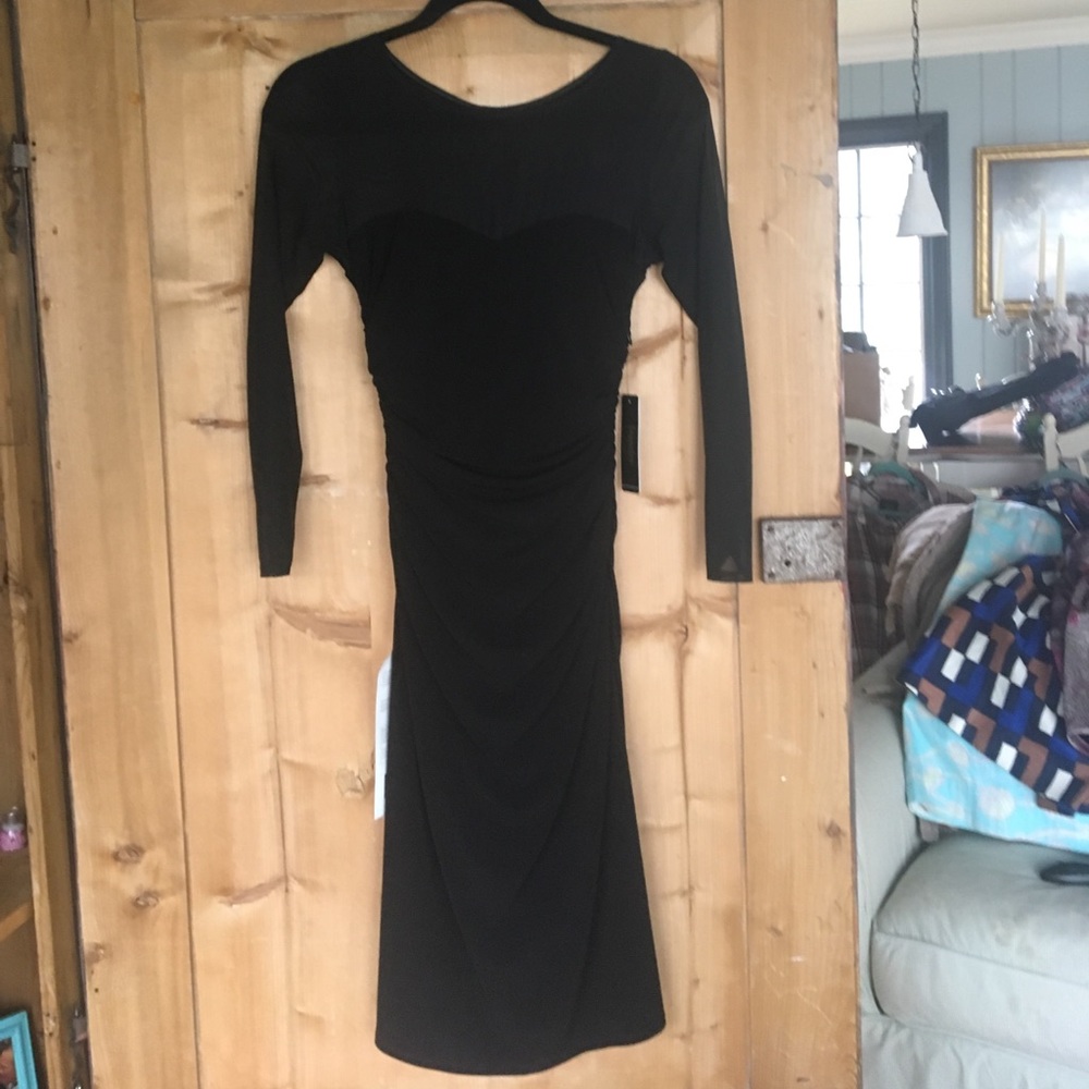 NWT black tight fit dress with mesh accents